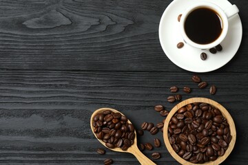 Cup of coffee with fresh coffee beans on wooden background