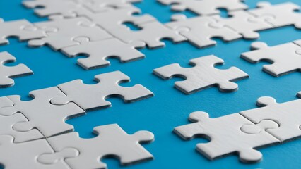 White jigsaw puzzle pieces on a bright blue background with visible gaps, emphasizing the importance of solving problems and creating connections in a team environment.