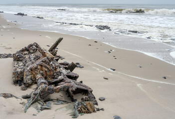 remains of sunken ship engine on  beach at Ocean shore, South West Seal shipwreck, Skeleton coast,...