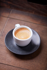 Cup of coffee on wooden background. Soft focus. Copy space
