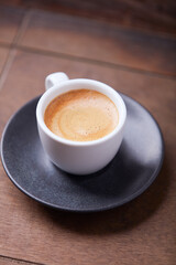 Cup of coffee on wooden background. Soft focus. Copy space
