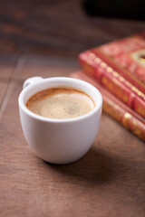 Cup of coffee on wooden background. Soft focus. Copy space