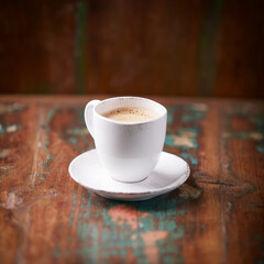 Cup of coffee on wooden background. Soft focus. Copy space