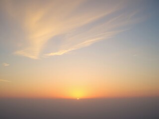 Sunrise over Foggy Landscape