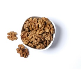 Walnuts in plate isolated on a white background