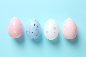 Flat lay composition with Easter eggs on color background