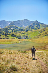 Obraz premium The Caucasian Biosphere Reserve. Tourism and outdoor recreation. A tourist goes hiking