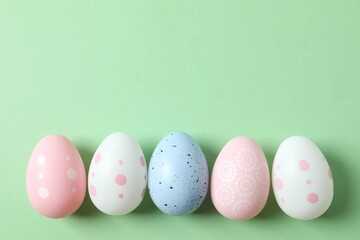 Flat lay composition with Easter eggs on color background