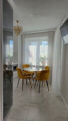 Marble table and yellow chairs in the interior