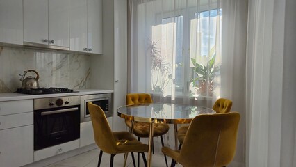 Marble table and yellow chairs in the interior