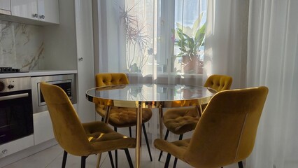 Marble table and yellow chairs in the interior