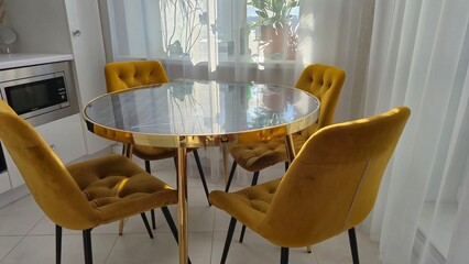 Marble table and yellow chairs in the interior
