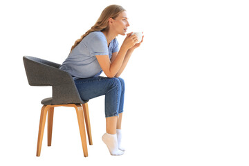 Young woman sitting in armchair and drinking coffee on a transparent background