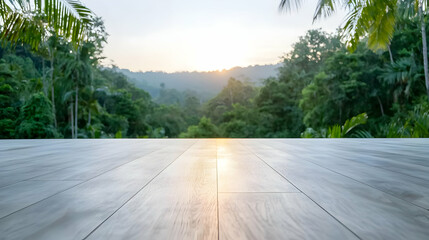Fototapeta premium Sunrise over lush jungle; wooden deck foreground