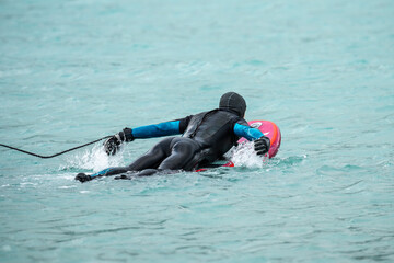 Wingfoil is a sport combining kitesurfing and windsurfing. Moment of getting into the water. Wing foil is a dynamically developing sport for everyone