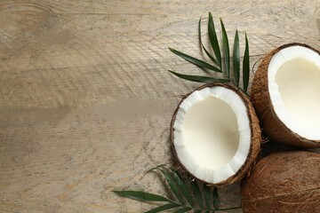 Coconut on wooden background, top view