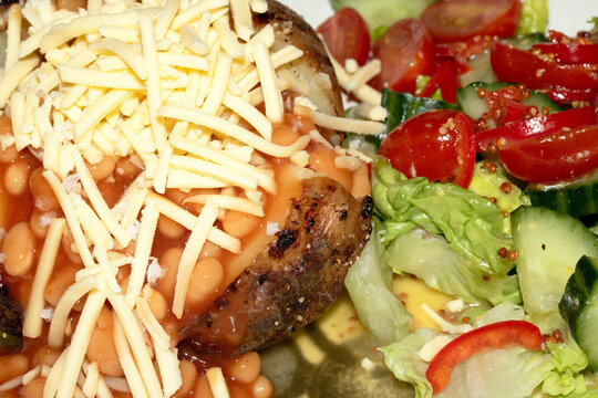 Close up of a Jacket Potato with Salad on White Background