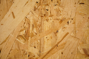 Real seamless texture, OSB plates of oriented fibers close-up, one-piece sheet.The surfaces of the walls in the attic, wood texture