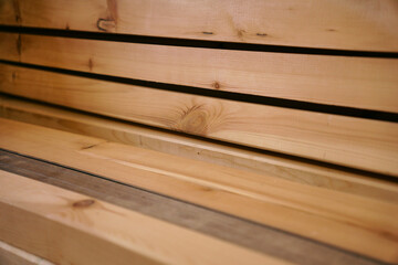 Lumber warehouse with wood texture, stacked wooden beams, joinery for renovation in the house and apartment