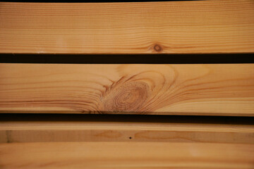 Lumber warehouse with wood texture, stacked wooden beams, joinery for renovation in the house and apartment