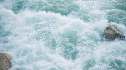 Ocean waves crashing against rocks