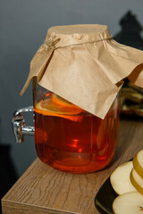 Moonshine in a jar. Homemade alcohol on the table.