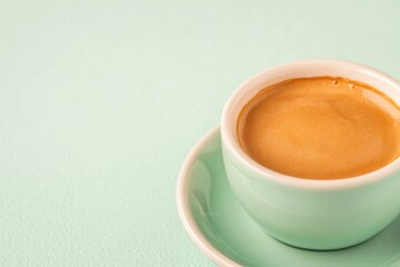 Rich espresso in mint-colored cup, creating calming and inviting