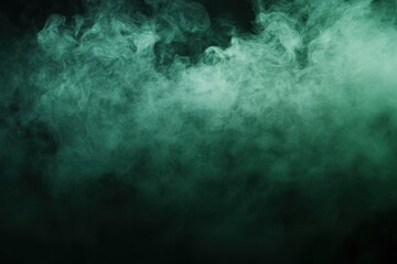 Abstract teal smoke texture on black background.