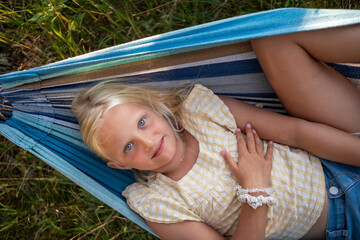 Directly above shot of girl lying down in hammock