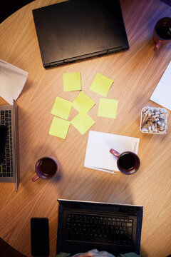Directly above shot of wooden table with office supplies