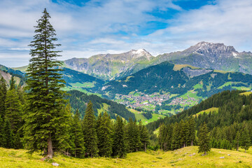 Obraz premium Scenic view of Adelboden, a beautiful mountain village and municipality in Switzerland, located in the administrative district of Frutigen in the Bernese Mountains.