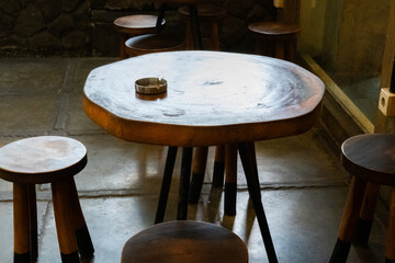 A café table with an ashtray, creating a relaxed and casual atmosphere for coffee and conversation
