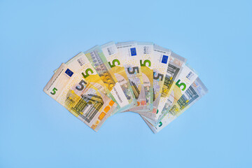 euro money bills lie on the table a lot of money a large amount of banknotes of five and twenty...