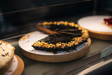 Chocolate cake with chocolate mousse in a pastry shop window.