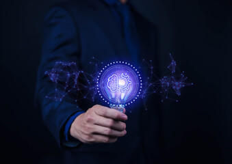 Creative businessman holding light bulb with network creative icons. Industry and marketing development. Strategic planning. Modern business and inspiration.
