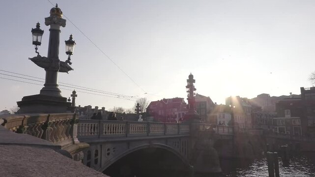 Scenic View of Magere Brug Bridge at Sunset with Boat 4k
