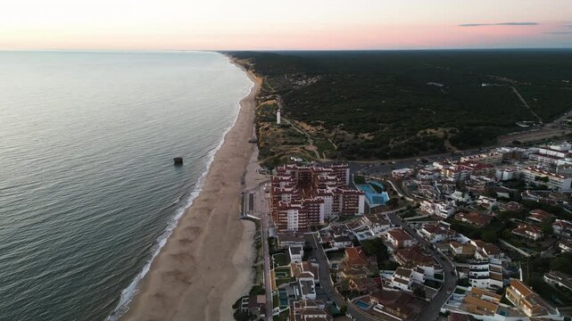 Calm sea and La Matalascanas cityscape, aerial drone view