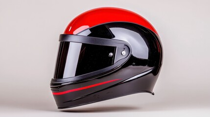 Fototapeta premium Sleek Black and Red Motorcycle Helmet with Glossy Finish and Clear Visor