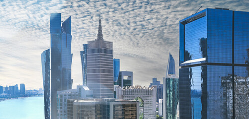 Doha Qatar - February 2024. Business district buildings skyline. Modern glass skyscrapers background