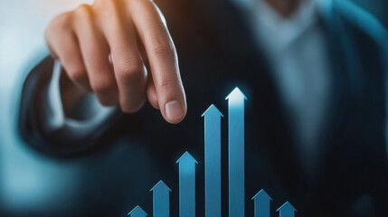 hand pointing at glowing upward arrows symbolizing business growth and success