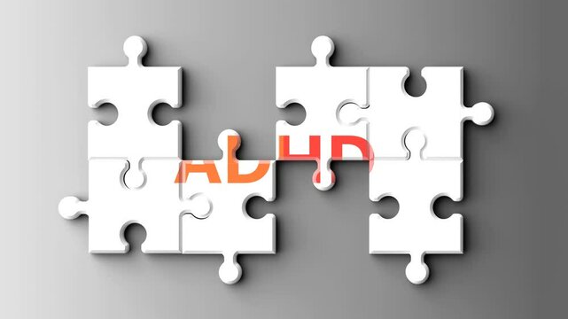 Adhd as a complex topic - pictured as word adhd on a puzzle pieces to show that adhd is a composite subject. Solving a puzzle. Pieces coming together to make a whole
