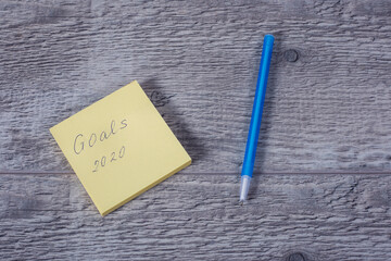  Text on paper  on wooden background, written by hand.