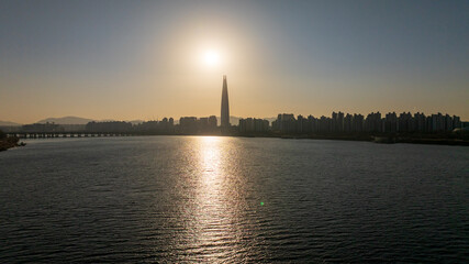 Naklejka premium Aerial view of Seoul, South Korea, with the Hangang River winding through the city, video by towering skyscrapers and historical landmarks 