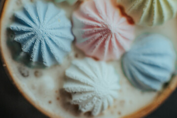 Close-Up of Colorful Meringues on Coffee