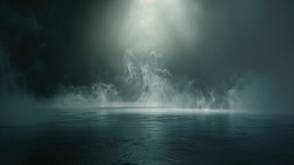 Fine mist rising off a smooth dark surface under soft light