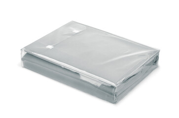 Folded grey cotton bedding sheets in clear plastic bag