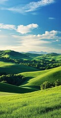 Vibrant Green Rolling Hills Against Bright Blue Sky with White Clouds and Mountain Range in Background