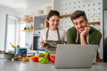 Secret ingredient is love. Couple preparing a healthy meal together while spending free time at home