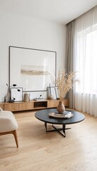 A minimalist living room with white walls and light wood floors, featuring a beige armchair and a round black coffee table.