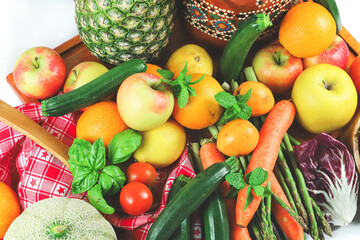 rustic composition of mixed fruits and vegetables viewed from above